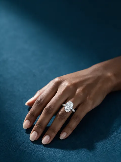 AI on hand image: oval ring navy, made by Grandior AI Studio